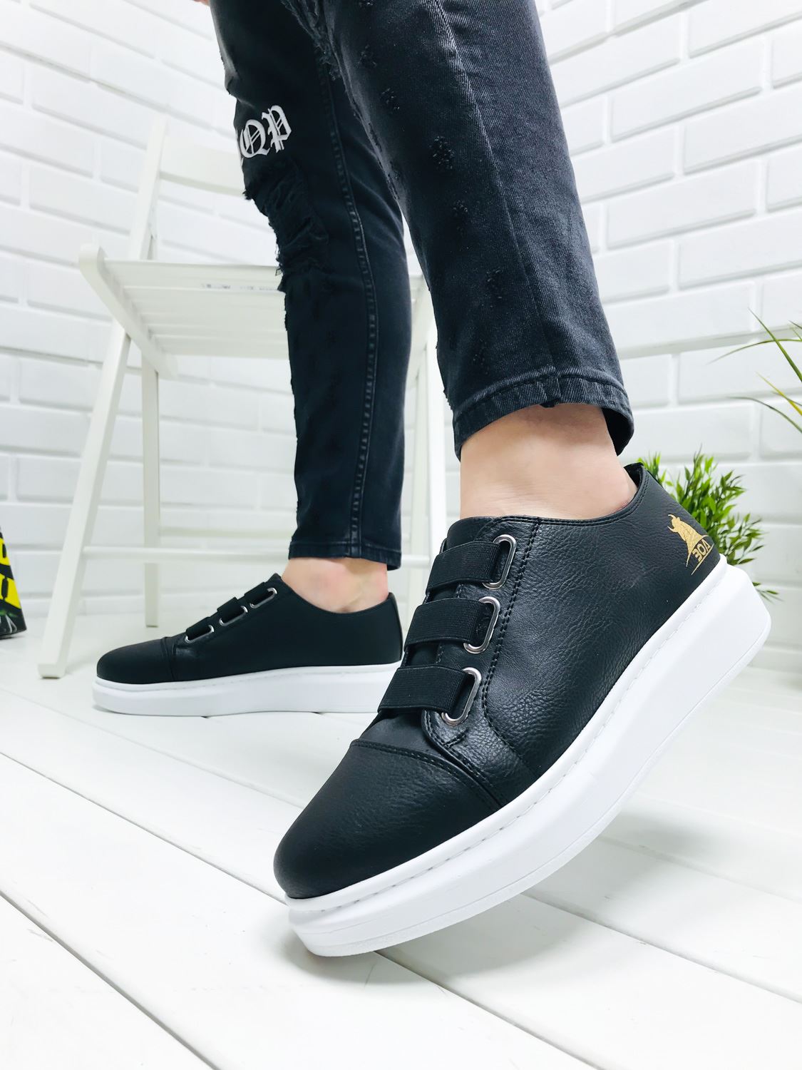 black sneaker with white sole