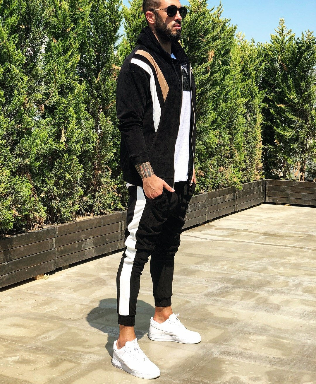 black tracksuit with white stripe