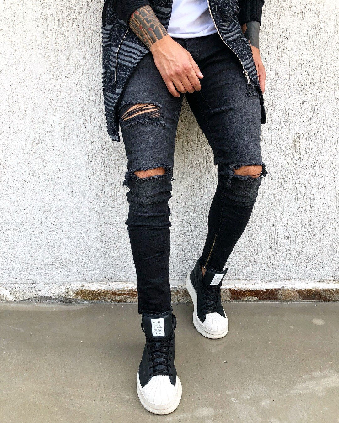 black jeans with ripped ankles