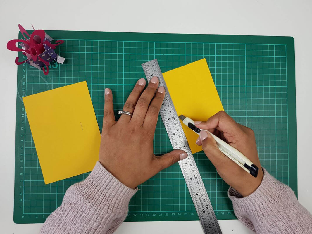 How to make a birthday card pop up card tutorial - picture of cutting the slots in the inner card covers