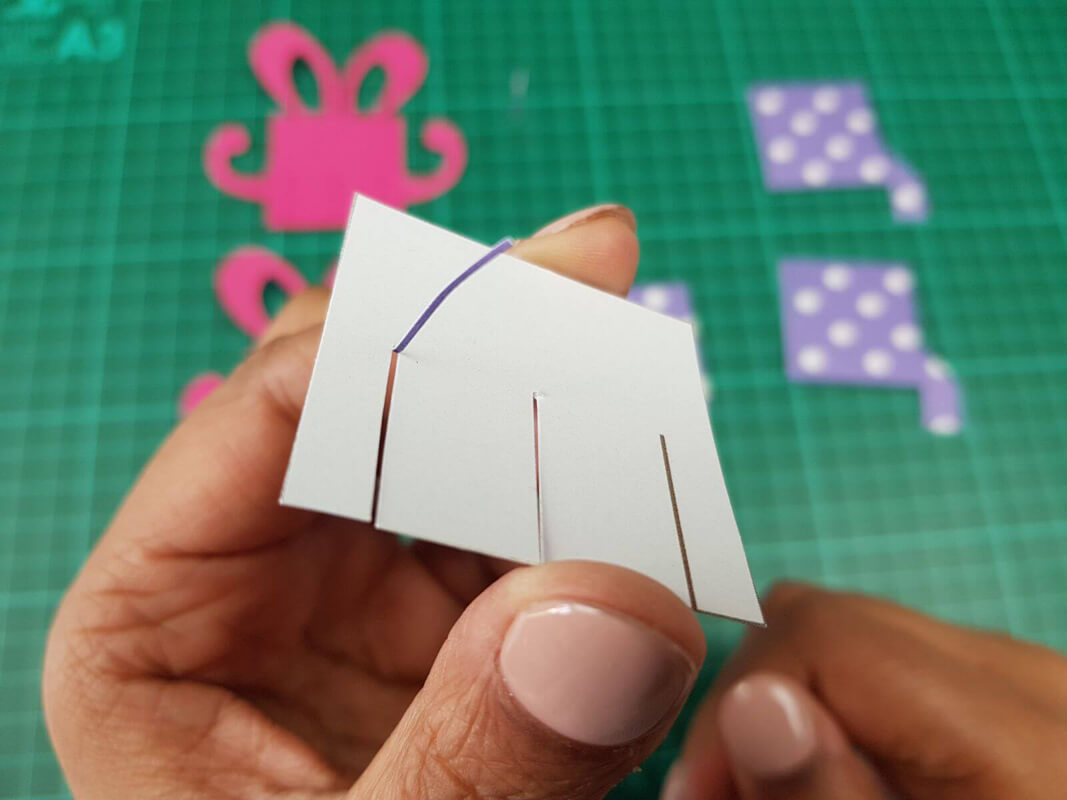 how to make a birthday pop up card tutorial - picture showing cutting a slot rather than a single slit