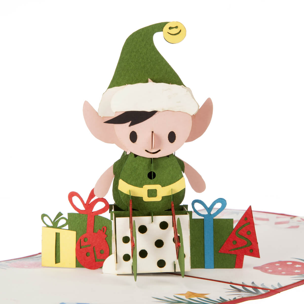 close up image of Elf Christmas Pop Up Card featuring an elf sitting on a mound of presents