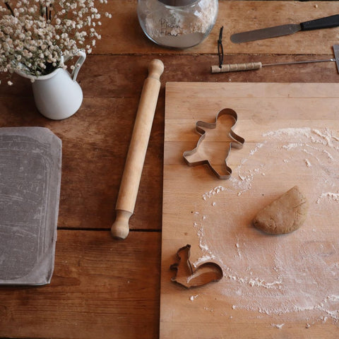 hygge aesethetic flatlay of gingerbread dough, rolling pin and cookie cutters. Hygge ideas from Bramble & Fox