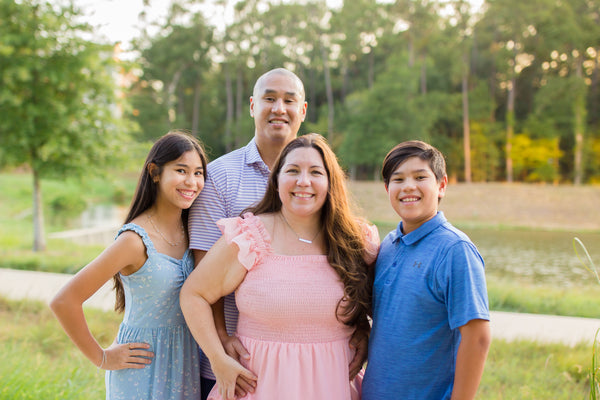 Photo of the Huynh Family featuring Melissa and her husband, daughter, and son