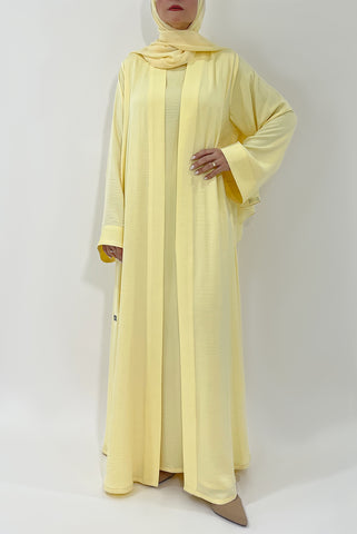 woman wearing beautiful yellow color abaya by thowby