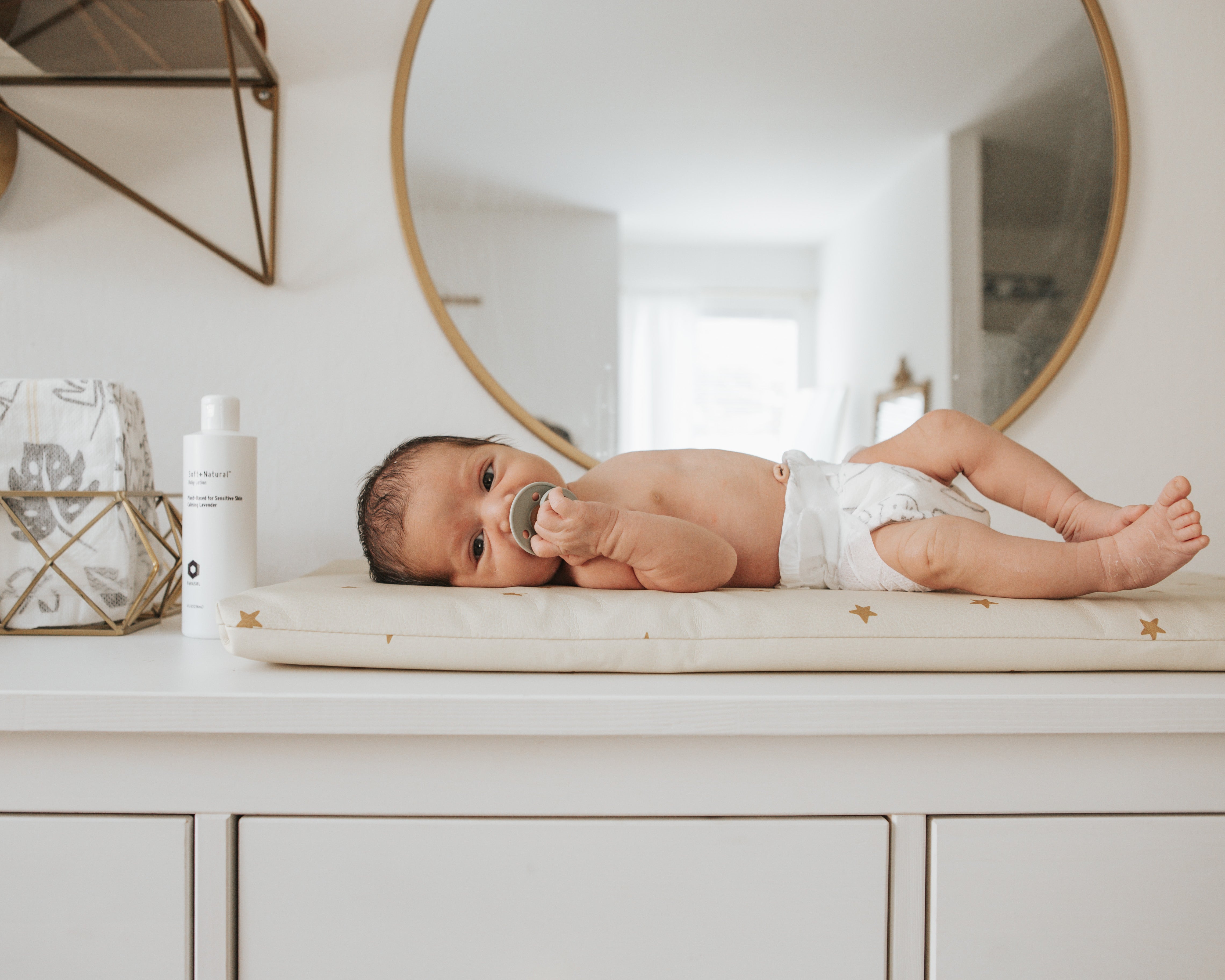 Baby On top of cabinet