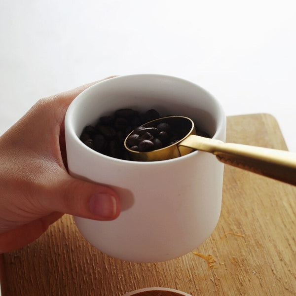 Small white ceramic coffee beans storage