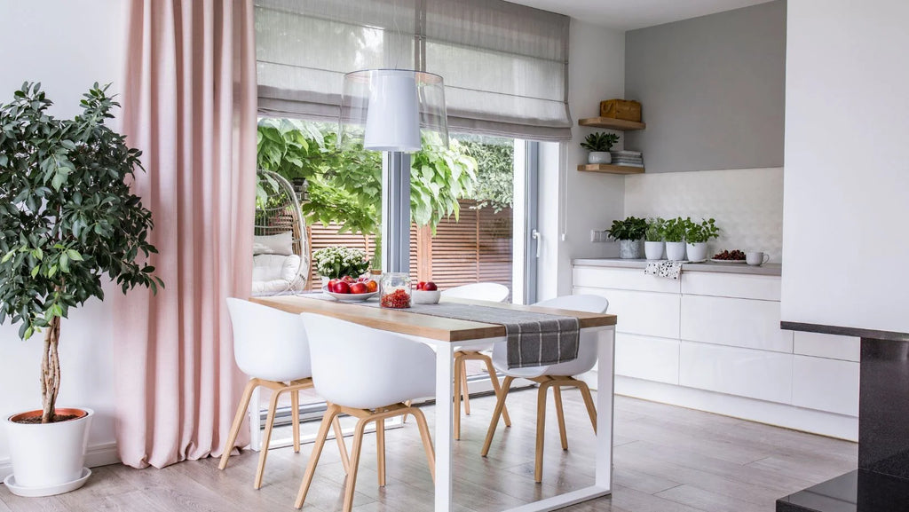 bay window with pink roman shades