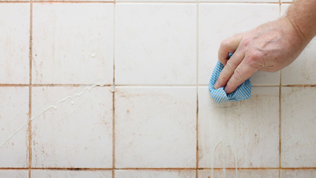 Cleaning dirty bathroom tiles