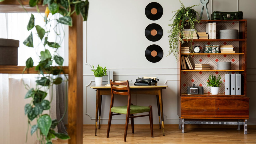 A home library adorned with greenery and a soft autumn palette