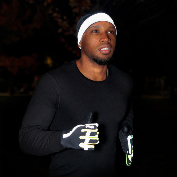 Runner running at night wearing GearTOP Reflective Running Gloves