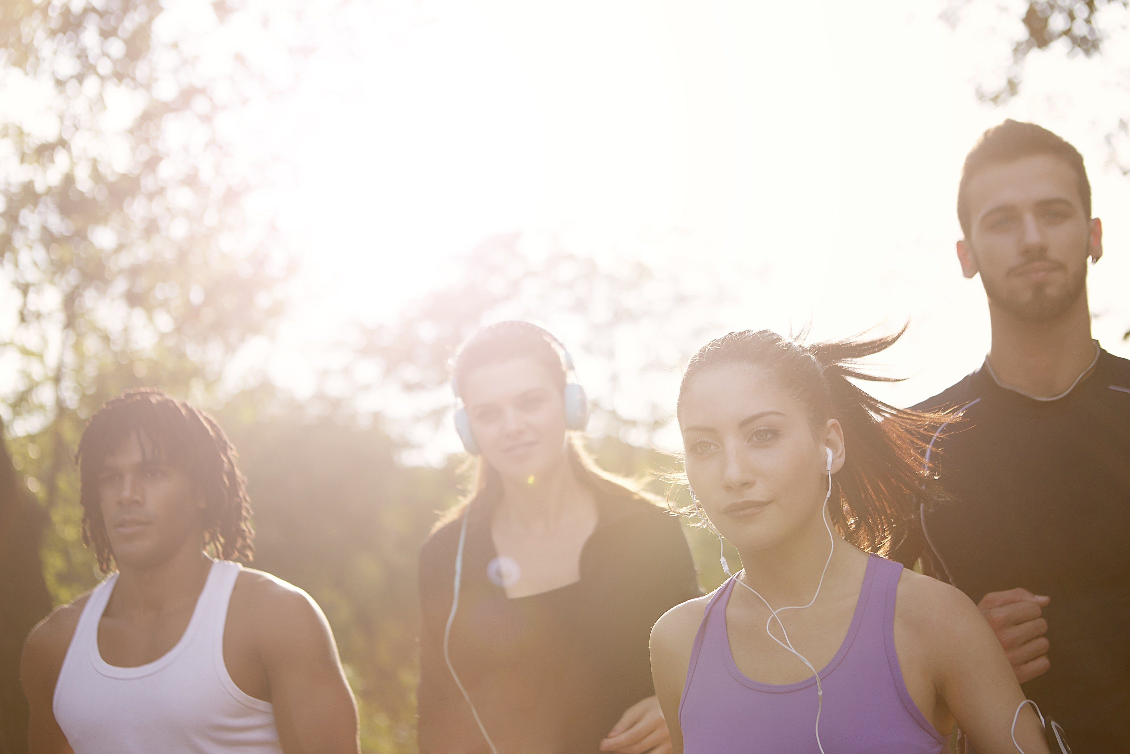 four people running