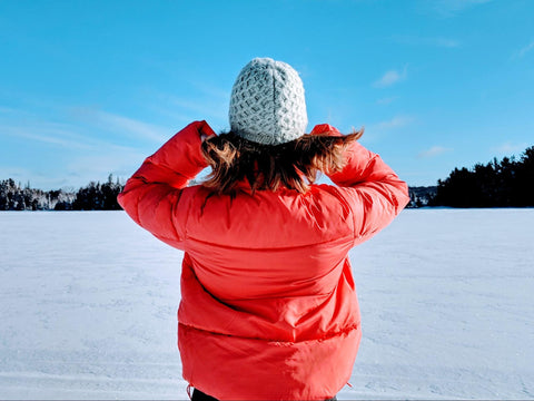 girl dressing in layers in the winter to stay warm