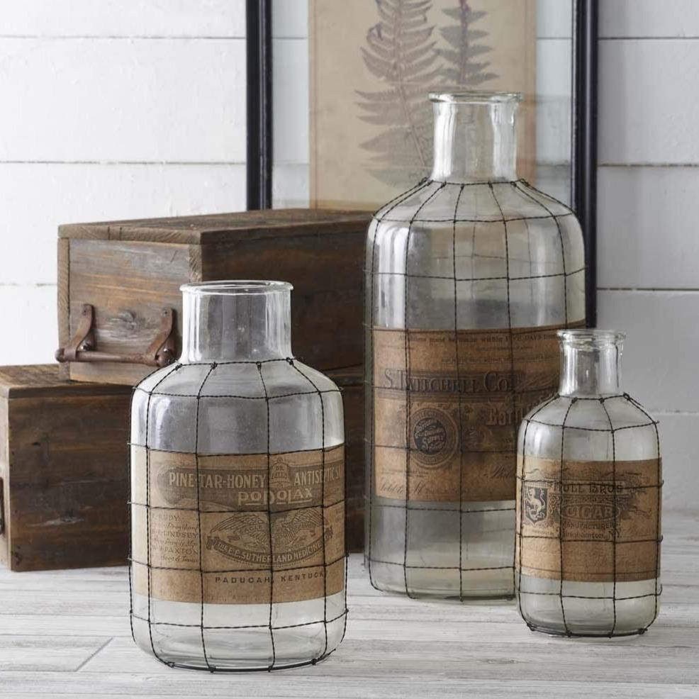 https://cdn.shopify.com/s/files/1/0091/7294/2912/products/Vintage_Label_Glass_Bottle_With_Wire_Surround_8_1600x.jpg?v=1661703530