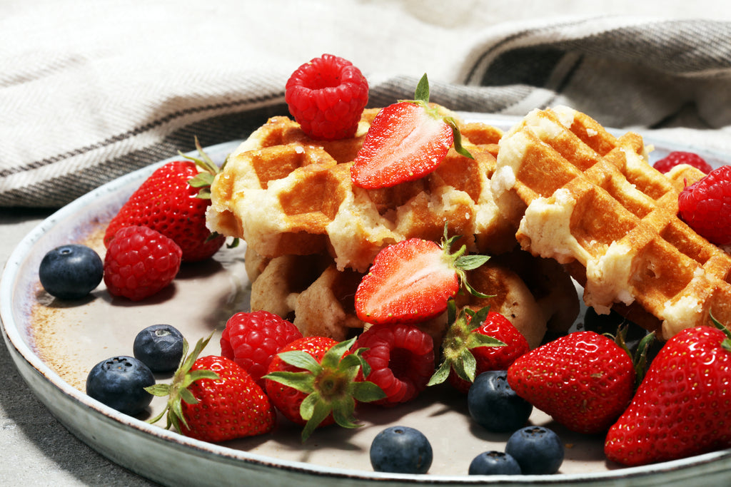 waffles with blueberries and strawberries on top