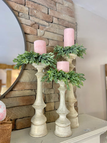 pink candles witting on Rainwashed Candle Rings on tall candle holders of mantel