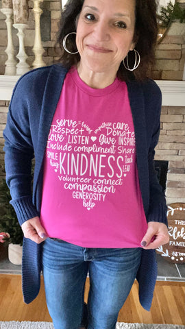 woman wearing Kindness short sleeve tee in berry color with navy blue cardigan