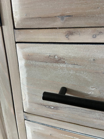 close up of new modern black drawer pulls on a white washed drawer