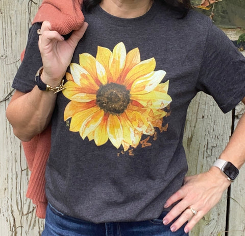 close up of a dark gray tshirt with a sunflower and butterflies