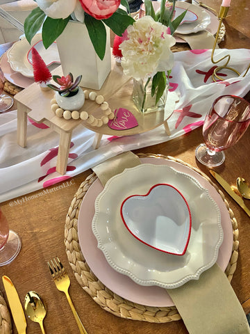 valentine's day placesetting with heart shaped plate and gold silverware