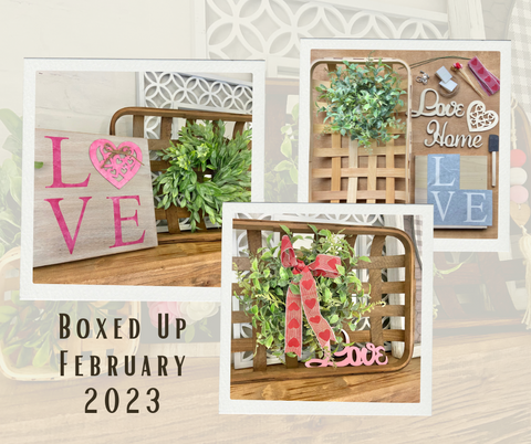 craft project with love and heart laser cut pieces, ribbons and greenery paired with a tobacco basket background