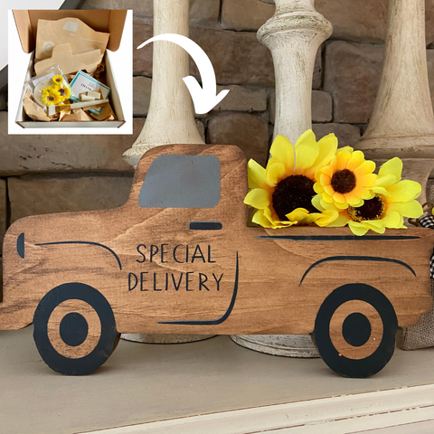 wooden truck with yellow sunflowers in the truck bed