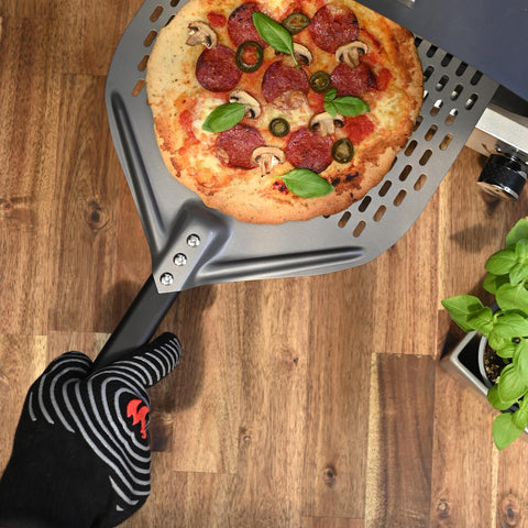 Pizza-on-spatula-with-glove