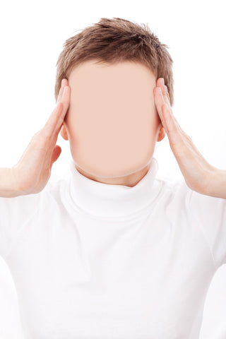 Man rubbing his temples with face blurred out