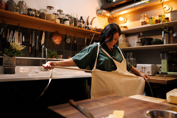 chef megan ties apron in kitchen