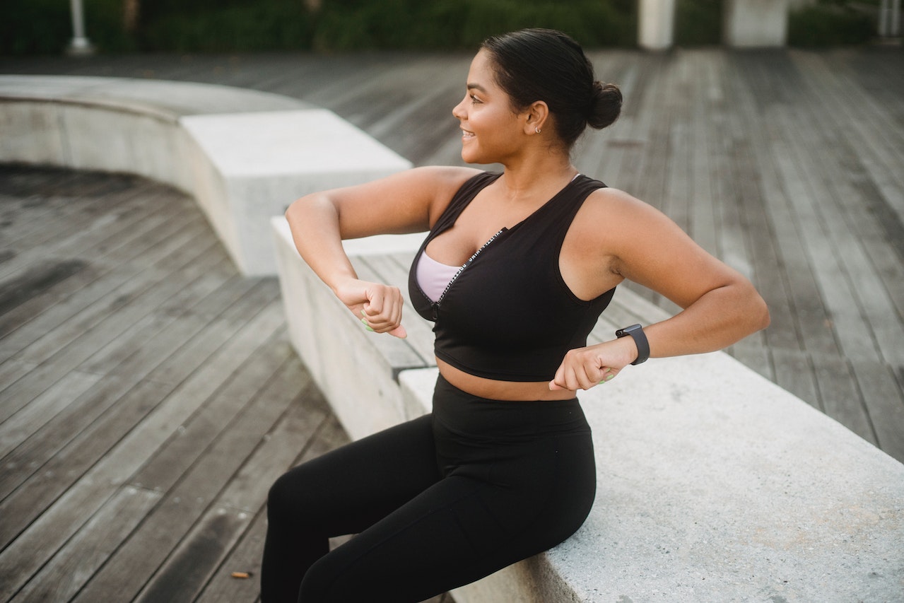 Young Pregnant Woman Wearing Sport Bra Drink Water after Workout