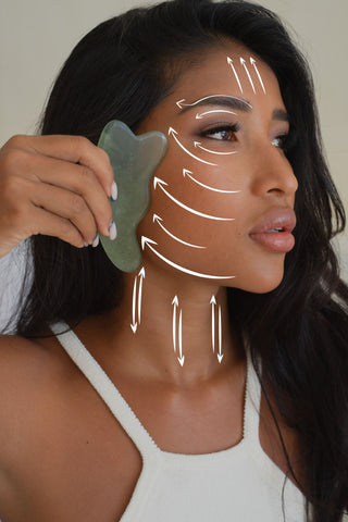 A girl using Holistick Gua Sha to lift and sculpt her face
