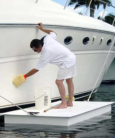man using an AccuDock work float to easily maintain his boat
