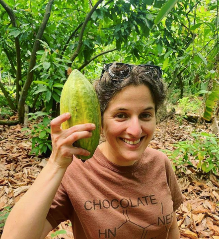 Carolina Quijano holding a Cacao Pod