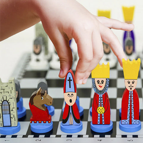 little kid playing with Educational Chess Set