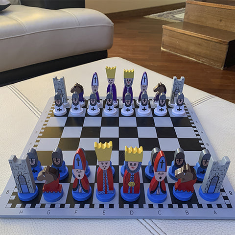 educational wooden cartoon chess set on a desk