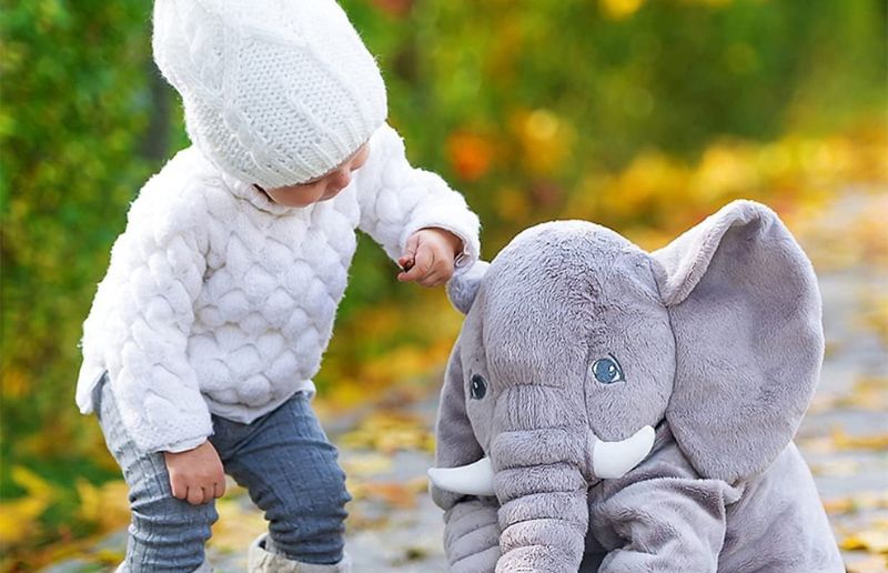 a-child-having-fun-with-his-elephant-stuffed-animal