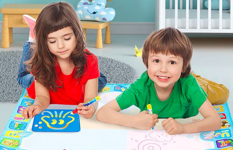 kids-expressing-their-creativity-on-a-magic-drawing-mat