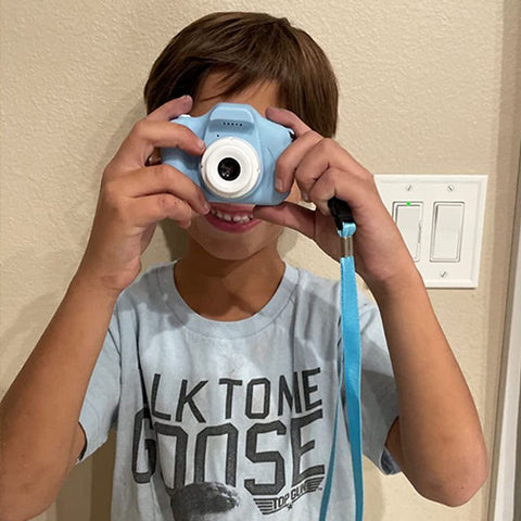 a child taking pictures using the littlelens camera