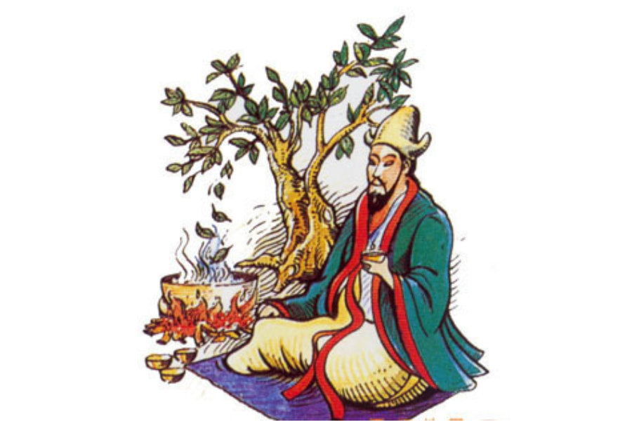 emperor sits in front of tea tree holding a cup of tea