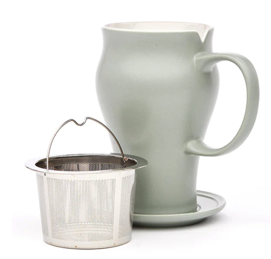 tea mug with infuser sitting in front