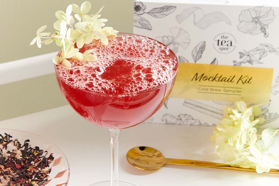 a tea mocktail sits in front of a box reading mocktail kit