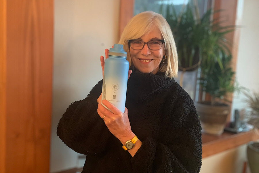 Tea Spot founder with charity: water bottle