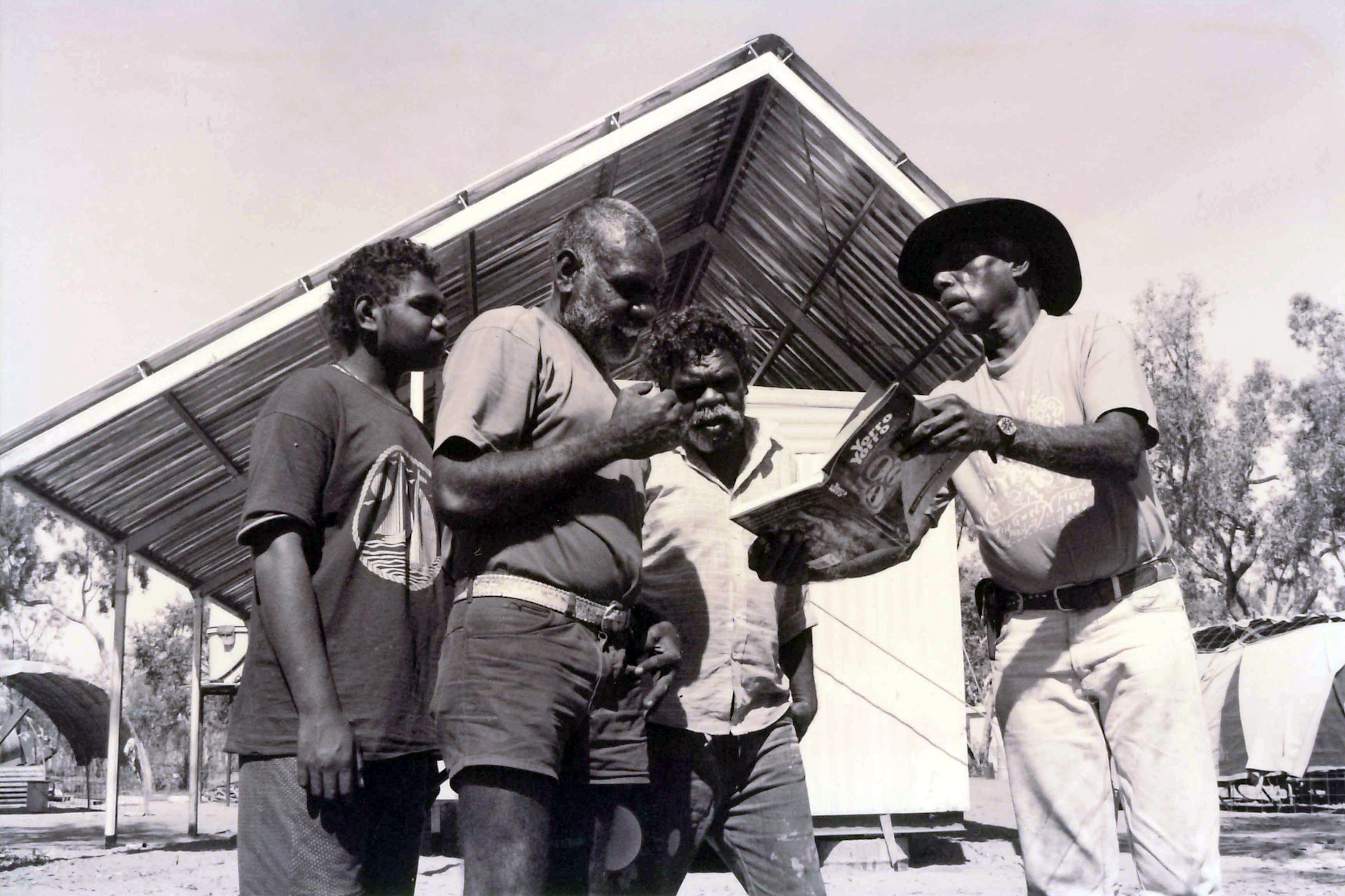 The late David Mowaljarlai (right) showing residents of Kalumburu 'Yorro Yorro', 1993