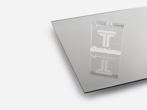a gray acrylic mirror sheet and acrylic block on white background