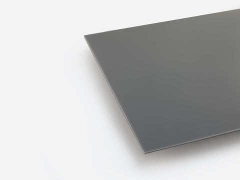 A dark gray opaque acrylic sheet on white background