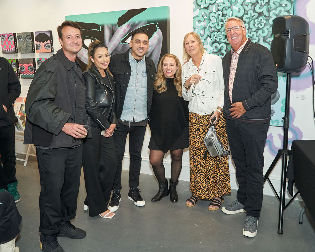 Photograph of a group of people during Ernie Steiner's "Figuratively Speaking" solo exhibition Opening Reception at Voss Gallery, San Francisco, April 22, 2022.