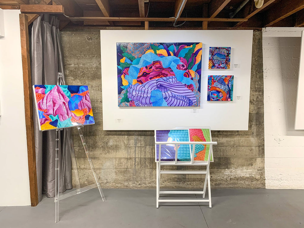 Install image from Jennifer Banzaca's "Utopia" solo exhibition of acrylic paintings at Voss Gallery in San Francisco, February 15-29, 2020. Photograph of paintings installed in the gallery's [The Down Low].