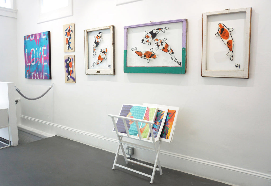 Photograph of koi fish wall art and fine art prints during Jeremy Novy's "The First Pride was a Riot" solo exhibition at Voss Gallery, San Francisco, June - July 2020.