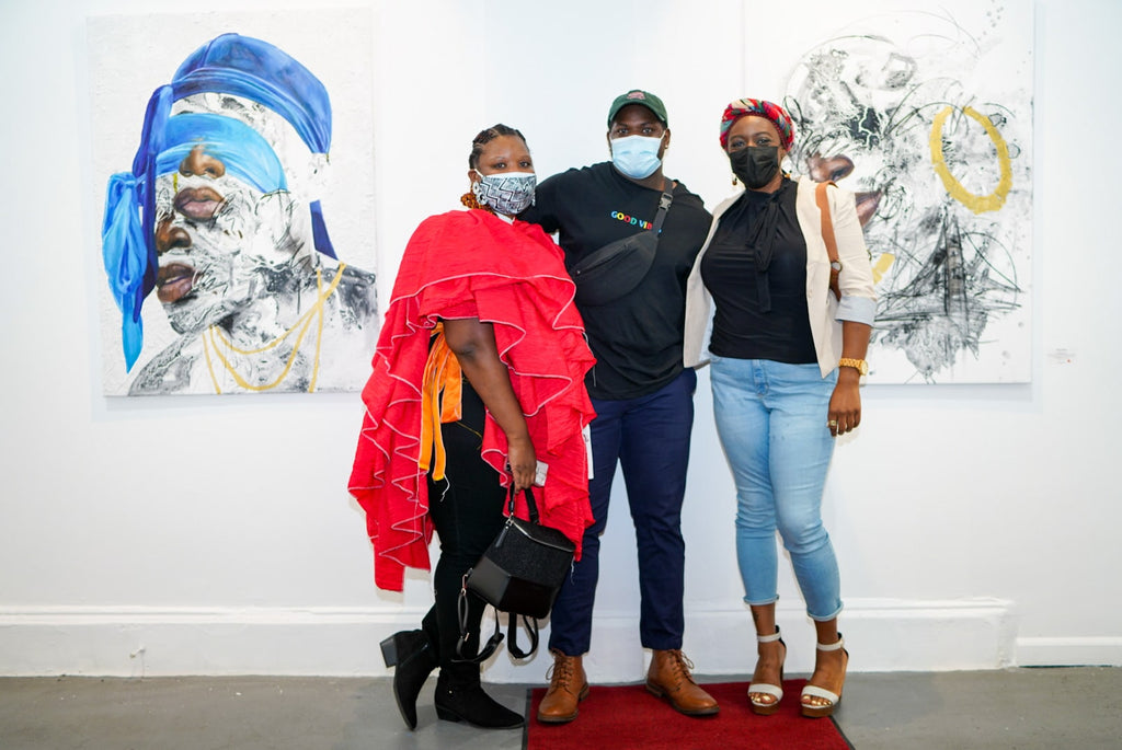 Photograph of artist with two lady guests during Khari Turner's "Hella Water" solo exhibition Opening Reception at Voss Gallery, San Francisco, May 21, 2021.