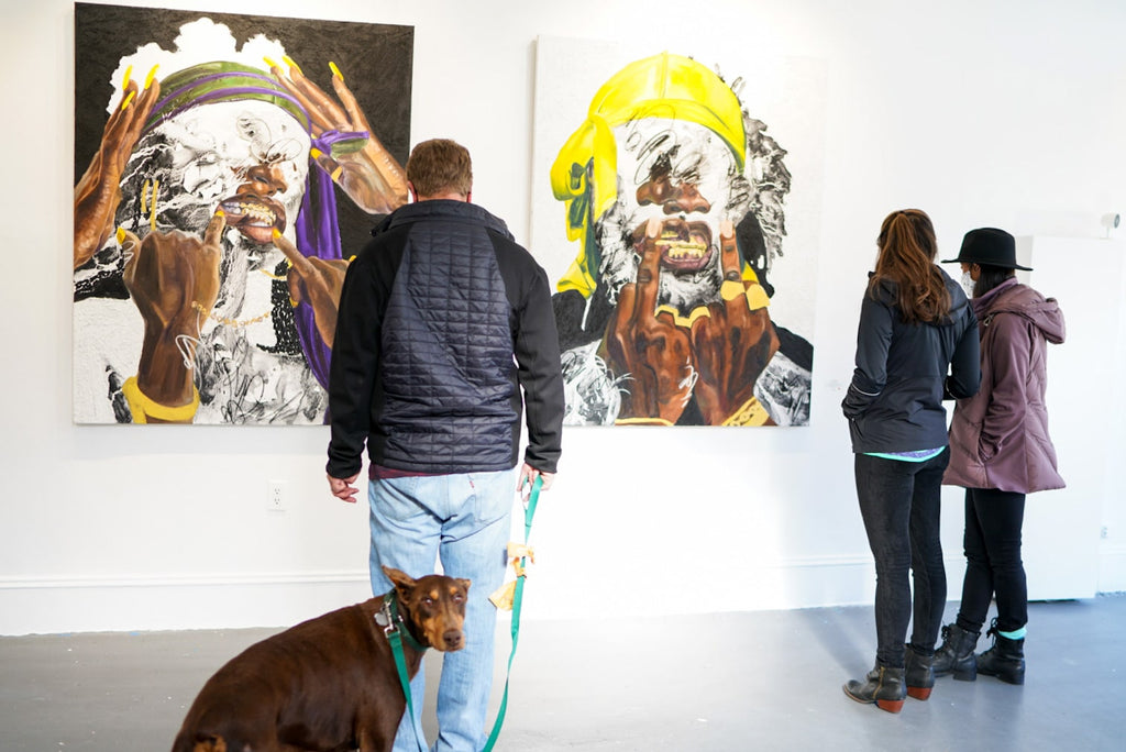 Photograph of people and a dog during Khari Turner's "Hella Water" solo exhibition Opening Reception at Voss Gallery, San Francisco, May 21, 2021.